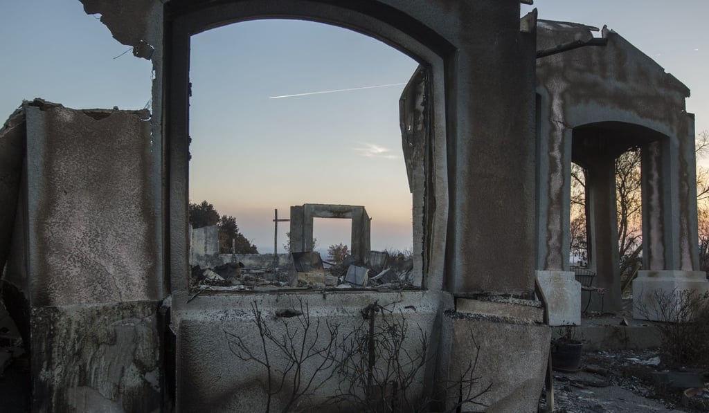 The ruins of houses destroyed by the Tubbs Fire are seen near Fountaingrove Parkway in Santa Rosa, California. At least 40 people are confirmed dead with hundreds still missing. Photo: AFP