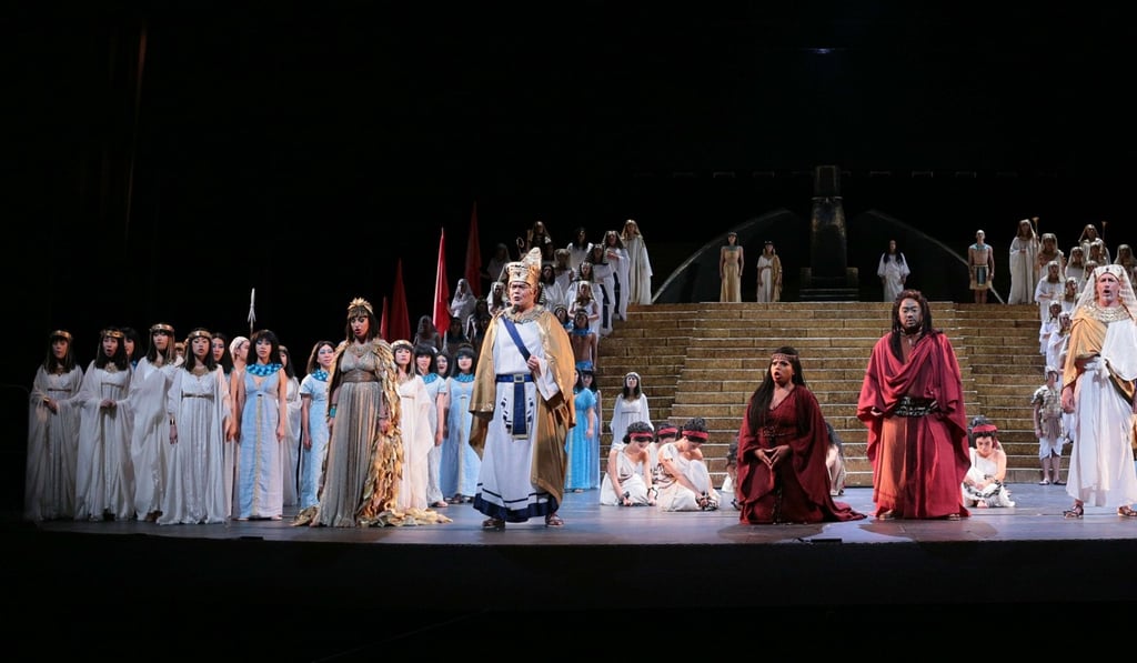 (From left to right): Nino Surguladze (Amneris), Freddie Tong (King of Egypt); Kristin Lewis (Aida), Sun Li (Amonasro), Paul Gay (Ramfis) and Najimiddin Mavlyanov ( Radames) in a scene from Act 2 of Verdi’s Aida. Photo: Opera Hong Kong