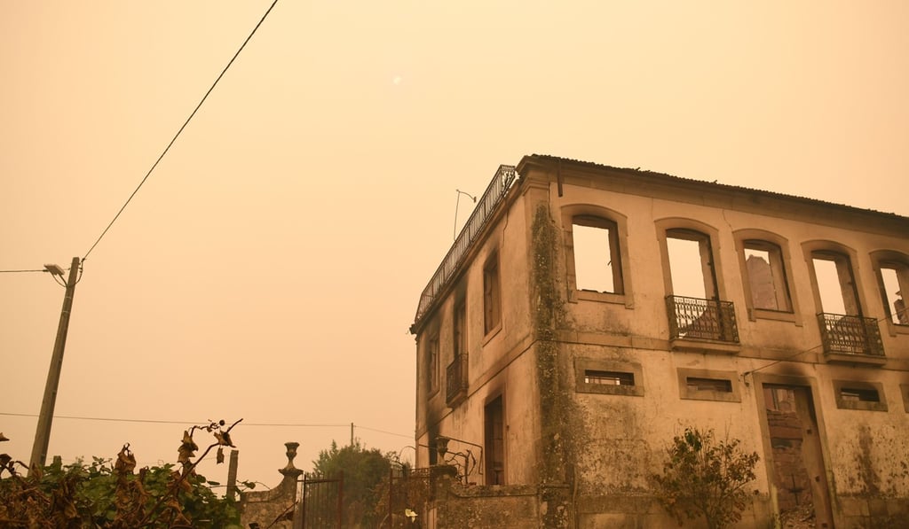 A picture shows a house gutted by a blaze near Vouzela as wildfires continue to rage in Portugal. Photo: AFP