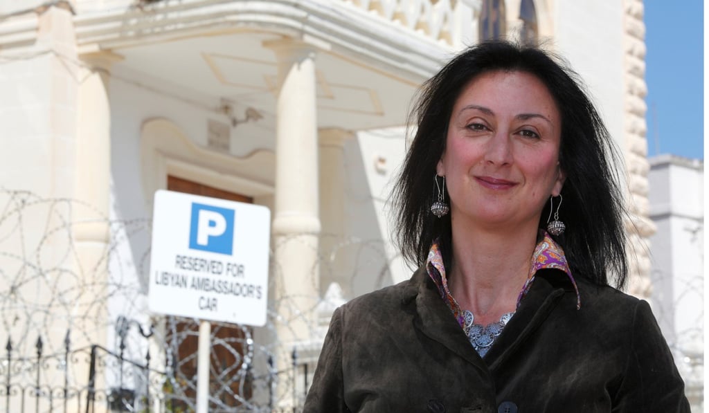 Maltese investigative journalist Daphne Caruana Galizia poses outside the Libyan embassy in Valletta in 2011. Photo: Reuters
