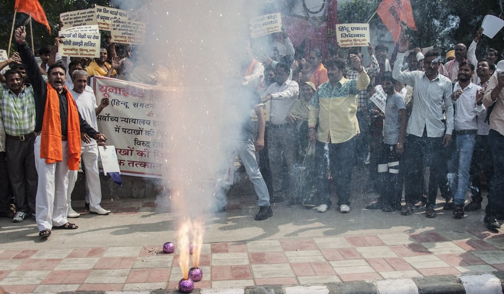 Indian Hindu activists protest against a temporary ban on the sale of firecrackers during Dewali. The government has taken numerous steps to curb choking air pollution in the Indian capital of New Delhi. Photo: Agence France-Presse Indian Hindu activists protest against a temporary ban on the sale of firecrackers during Dewali. The government has taken numerous steps to curb choking air pollution in the Indian capital of New Delhi. Photo: Agence France-Presse