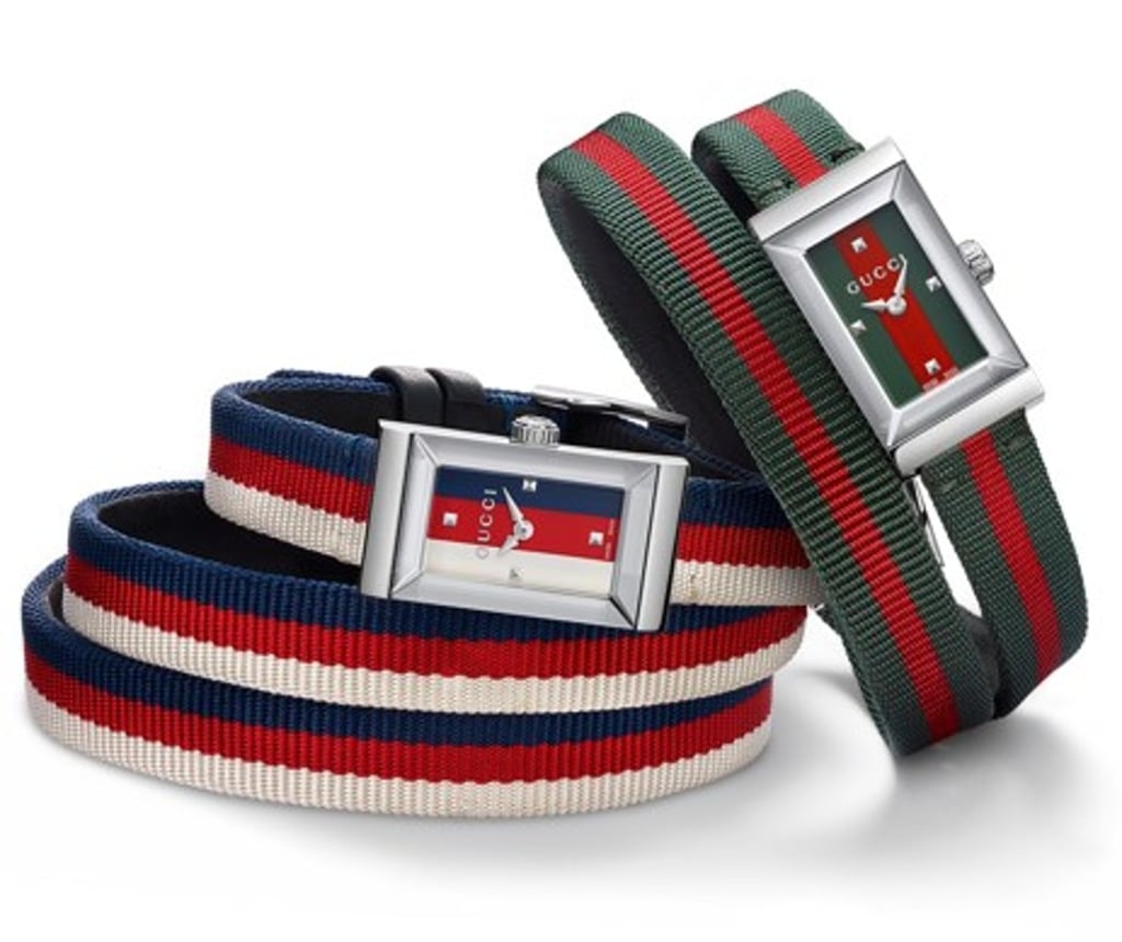 Gucci G-Frame timepieces feature straps in different colours.