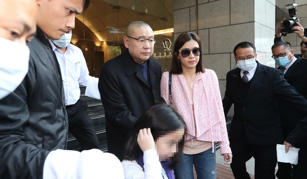 Joseph Lau Luen-hung (centre) and his wife Chan Hoi-wan pictured in March after Lau announced he had transferred his entire controlling stake in Chinese Estates to his wife and son. Photo: Edward Wong