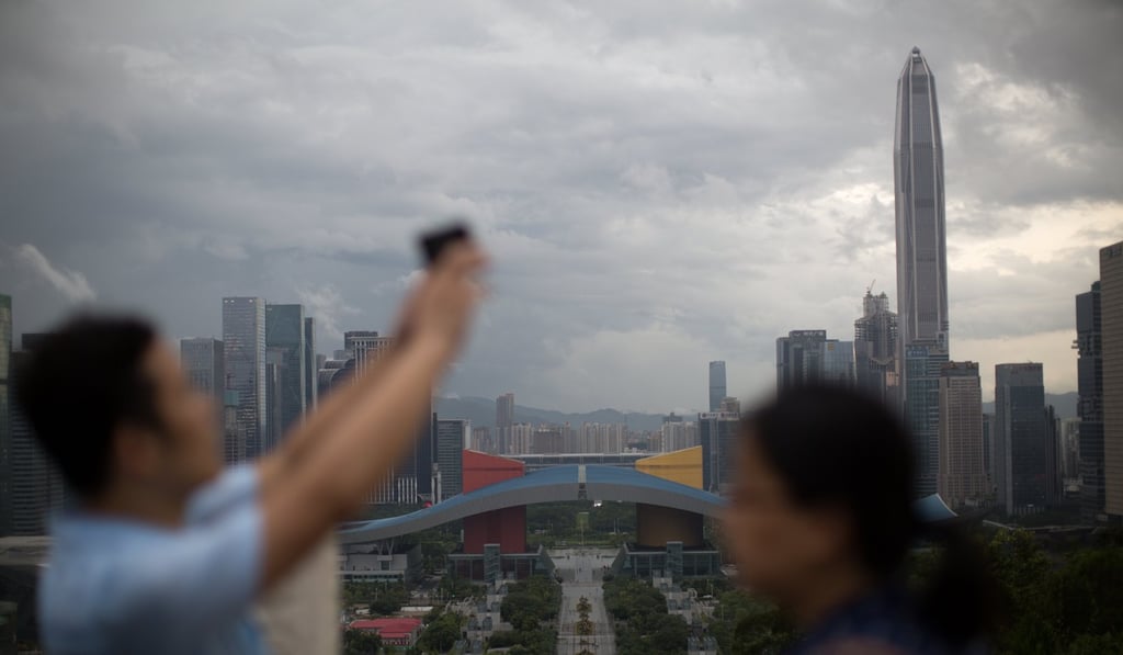 Visitors take photos in June, in Shenzhen, part of China's urbanisation push to develop the Greater Bay Area, which includes 11 cities in total, including Hong Kong. Photo: EPA/STR