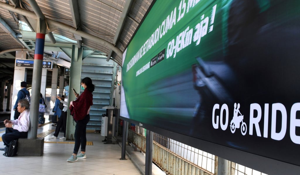 An advertisement for motorbike on-demand service Go-Jek at a railway station in Jakarta. Photo: AFP