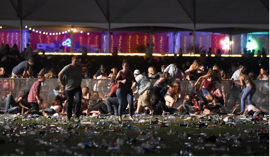 People running from the country music festival after gunfire was heard on October 1, 2017 in Las Vegas, Nevada. Photo: AFP People running from the country music festival after gunfire was heard on October 1, 2017 in Las Vegas, Nevada. Photo: AFP