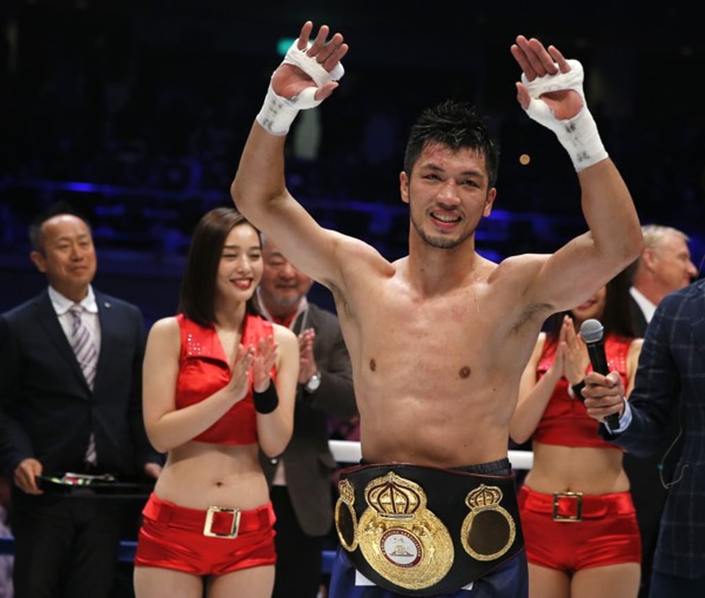 Ryota Murata wears his new championship belt. Ryota Murata wears his new championship belt.