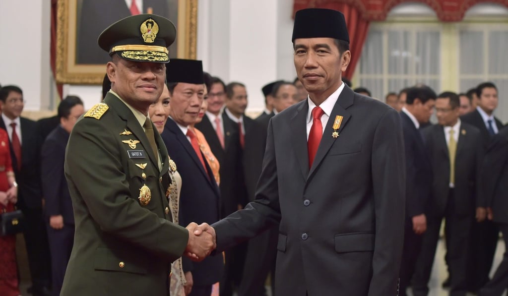 Nurmantyo shaking hands with Indonesia’s President Joko Widodo. Photo: AFP