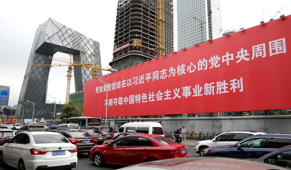 A giant banner in Beijing's central business district reads: ‘Unite closely around the party Central Committee with comrade Xi Jinping as the core, constantly win new victory for socialism with Chinese characteristics’. Photo: Reuters