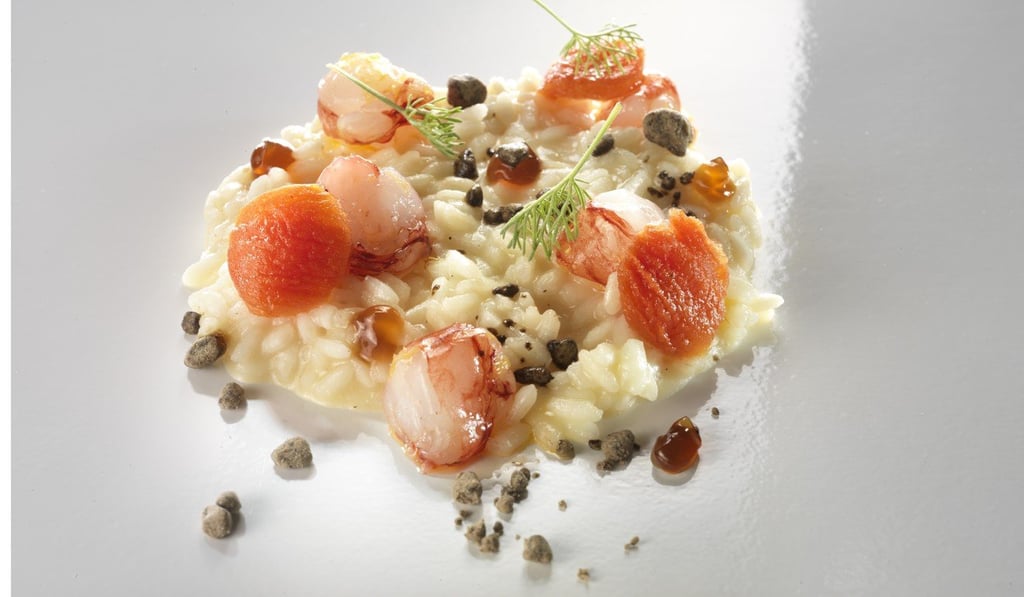 Risotto cooked with tomatoes and raw shrimp.