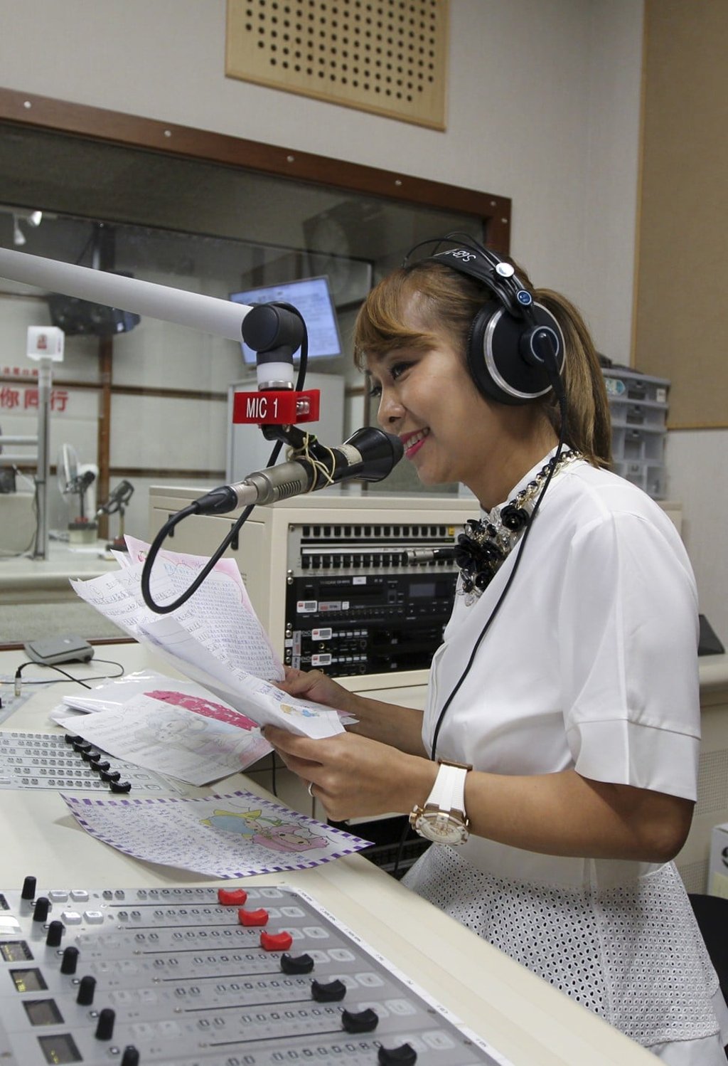 RTHK’s Vivian Yip reads out letters for prisoners during her show. Photo: James Wendlinger