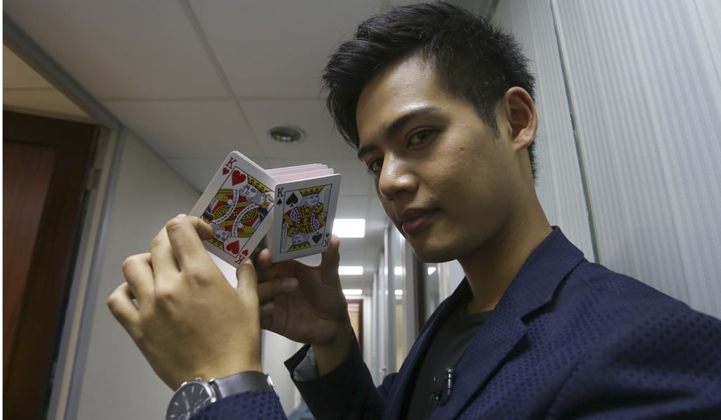 Magician Henry Harrius has a few card tricks up his sleeve. Photo: Jonathan Wong