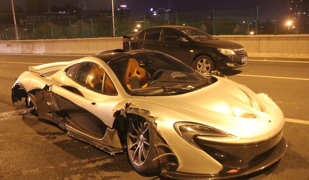 A damaged sports car is pictured after it collided with another car on a road in Yiwu city in Zhejiang province, in April 2016. A high number of traffic accidents, coupled with ongoing congestion and pollution, have contributed to China’s interest in driverless vehicles. Photo: Imaginechina