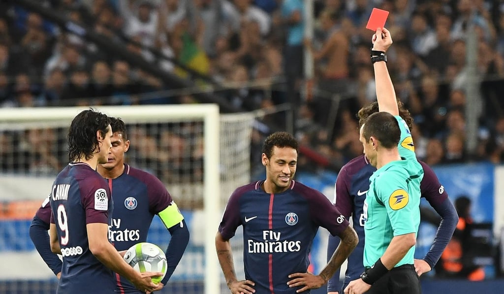 French referee Ruddy Buquet shows a red card to Neymar against Marseille. Photo: AFP French referee Ruddy Buquet shows a red card to Neymar against Marseille. Photo: AFP
