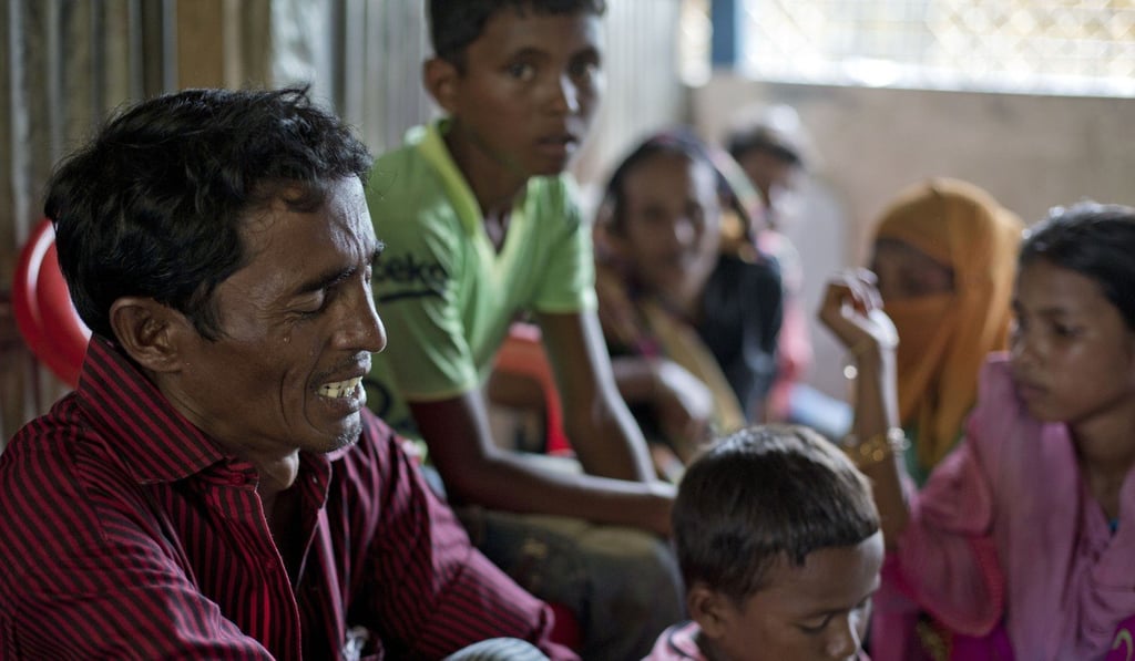 Mohammad Kasim, from Moidaung Village in Myanmar, weeps at a transit shelter for newly arrived Rohingya refugees in Bangladesh. Kasim's wife and two daughters drowned when the fishing boat they were travelling in capsized on September 28. Photo: AP