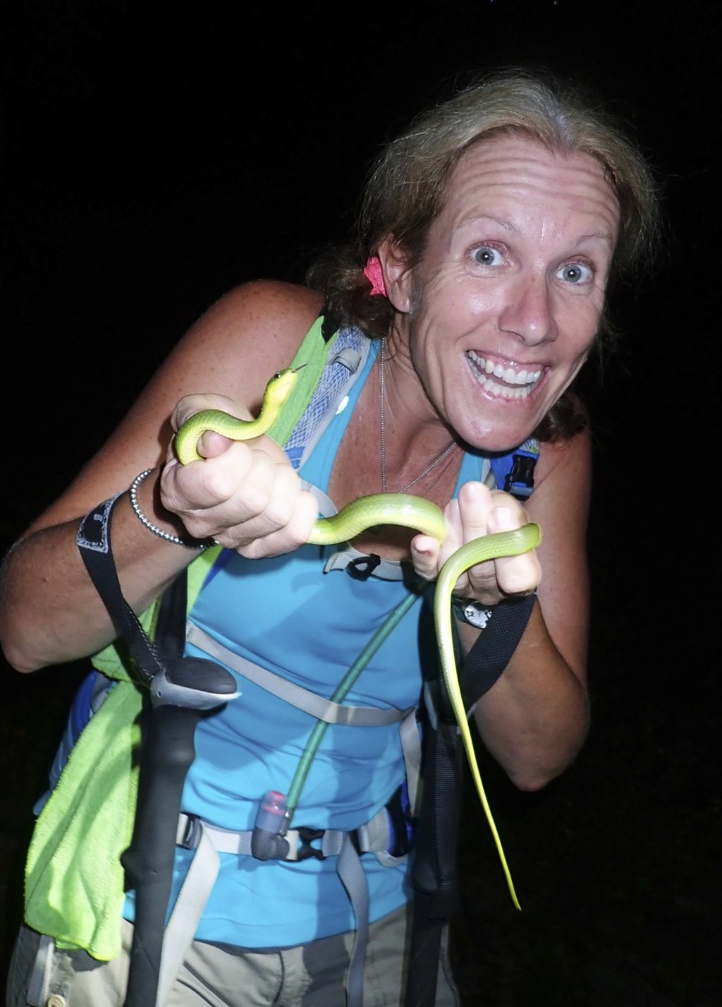 Tara Smyth holds a greater green snake near Tai Mo Shan. Photo: Red Door News