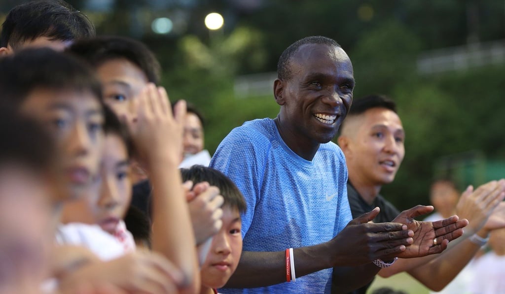 Eliud Kipchoge enjoys his time with athletes from the Nike Run Club. Photo: Xiaomei Chen