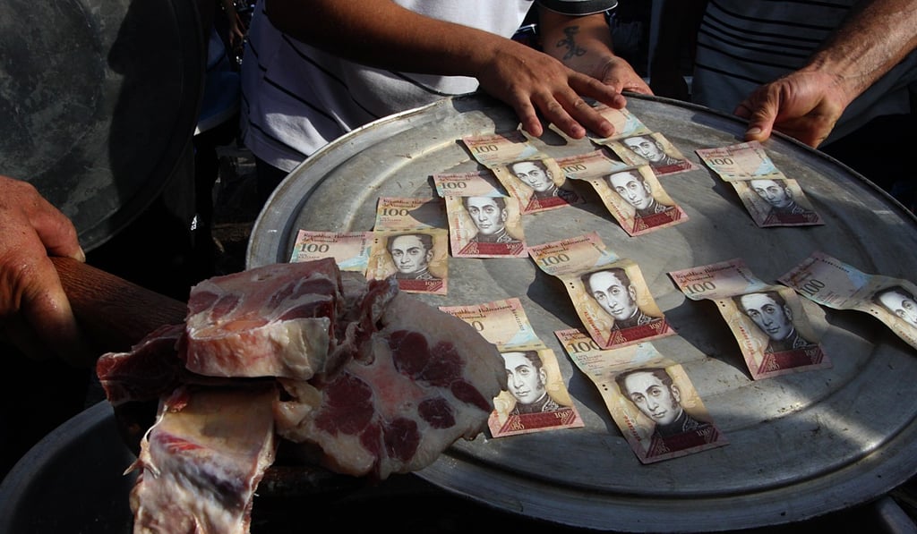 Venezuela citizens protest over the lack of cash in San Cristobal last December, after rampant inflation rendered 100-bolivar banknotes worthless. Thousands took to mining cryptocurrency such as bitcoin for relief during the currency crisis. Photo: AFP