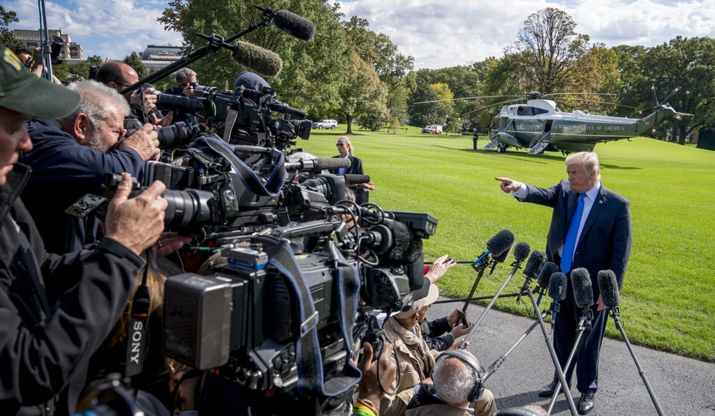 Donald Trump speaking to reporters before boarding Marine One on at the White House. Photo: AP