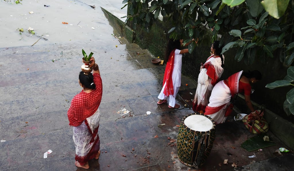 A Hindu performs a religious ritual on the banks of the holy river Ganges. Photo: AFP A Hindu performs a religious ritual on the banks of the holy river Ganges. Photo: AFP