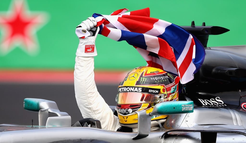 Lewis Hamilton on a victory lap. Photo: AFP Lewis Hamilton on a victory lap. Photo: AFP