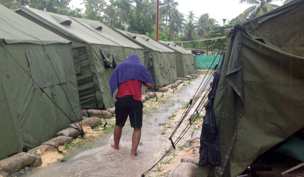 A man walks between tents at Australia's regional processing centre on Manus Island in Papua New Guinea. File photo: AFP A man walks between tents at Australia's regional processing centre on Manus Island in Papua New Guinea. File photo: AFP