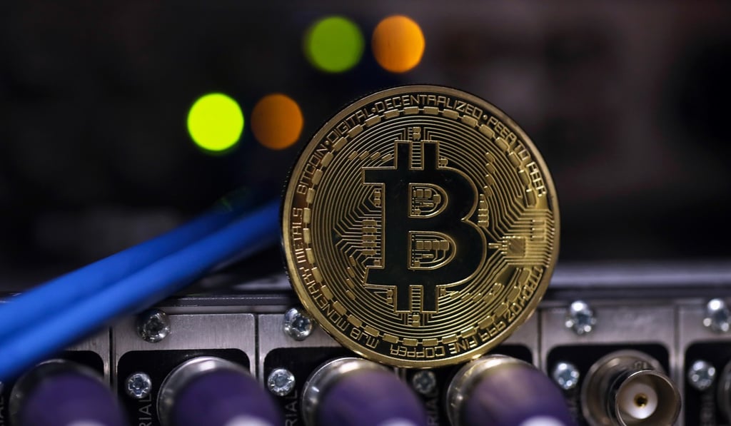 A bitcoin sits on coaxial cables inside a communications room at an office in London. Photo: Bloomberg A bitcoin sits on coaxial cables inside a communications room at an office in London. Photo: Bloomberg
