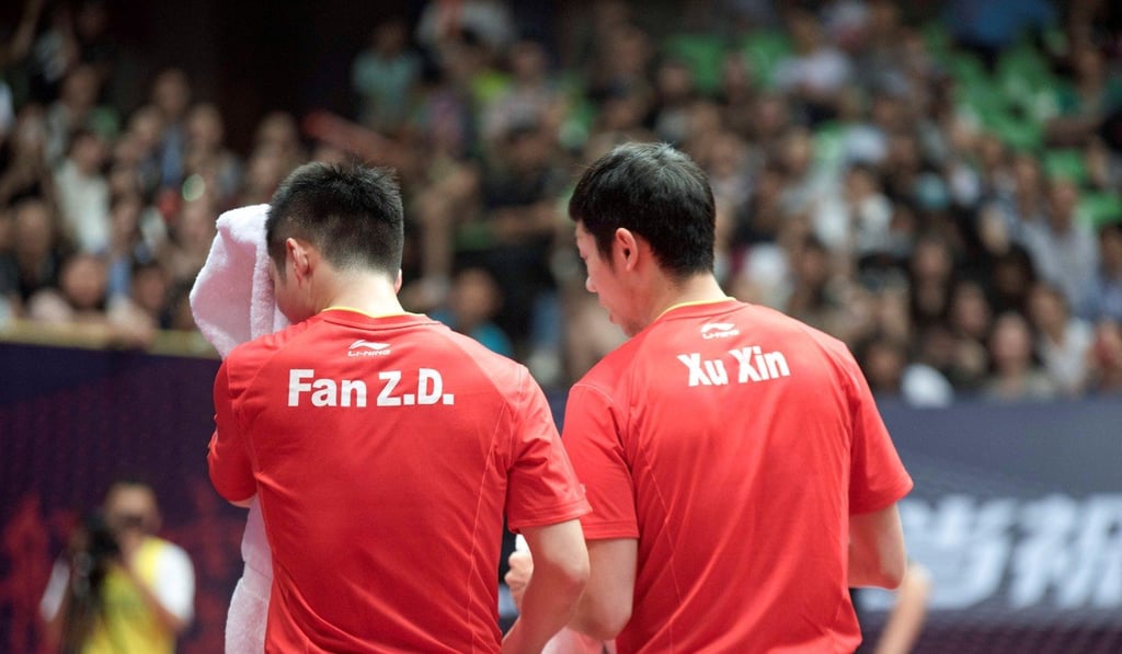 Xu Xin and Fan Zhendong in doubles action at the China Open. Photo: Reuters