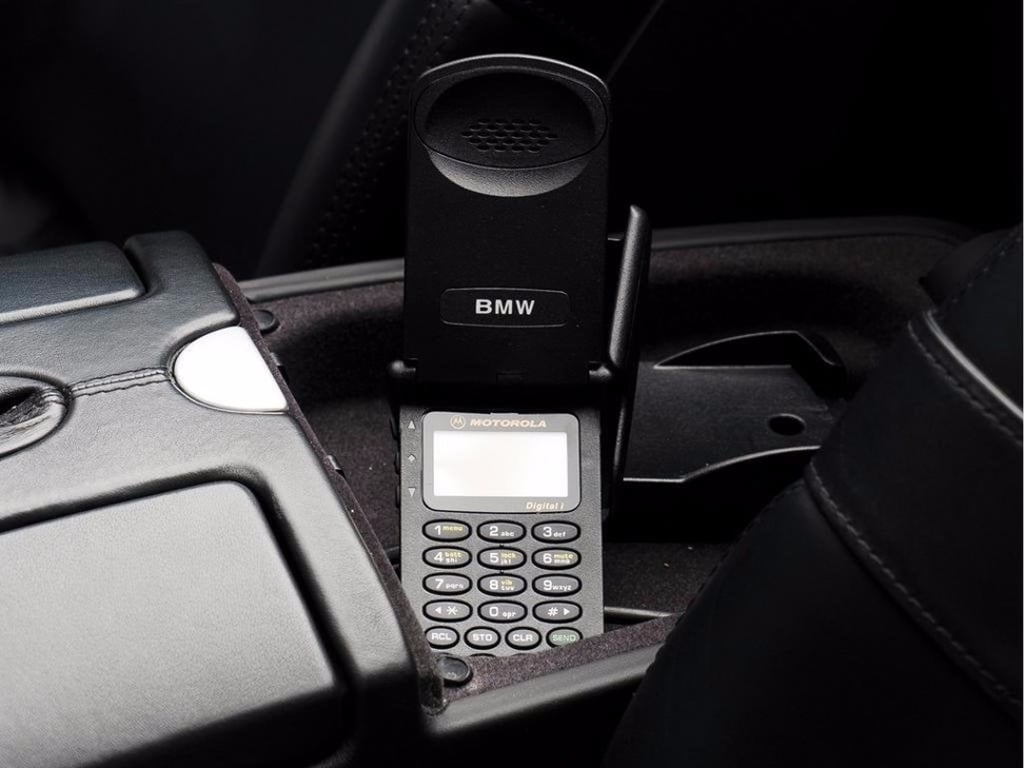 The car comes with the original Motorola flip-phone built into the display.