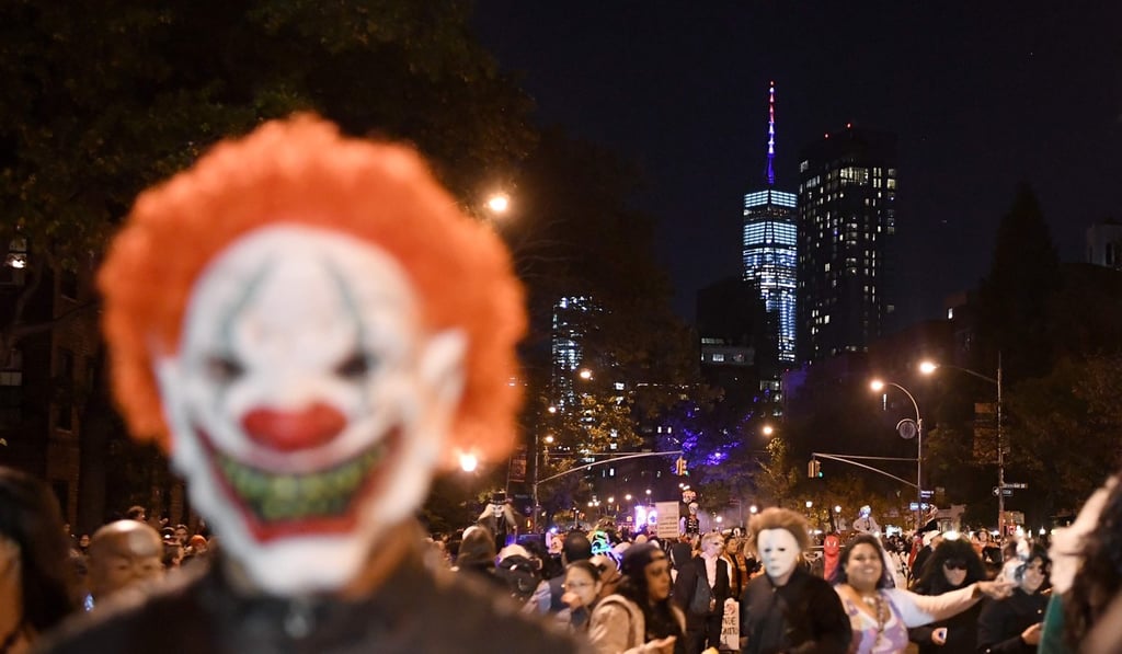 The Freedom Tower is seen in the background as people in costumes take part in the 44th Annual Halloween Parade in New York. Photo: AFP
