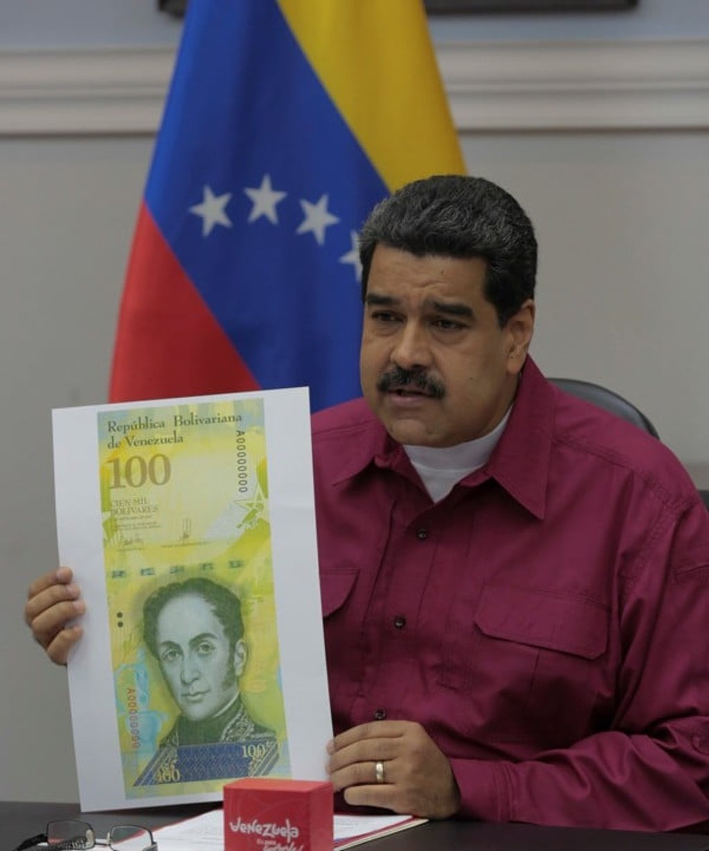 Maduro holding a sample of the new note. Photo: Reuters