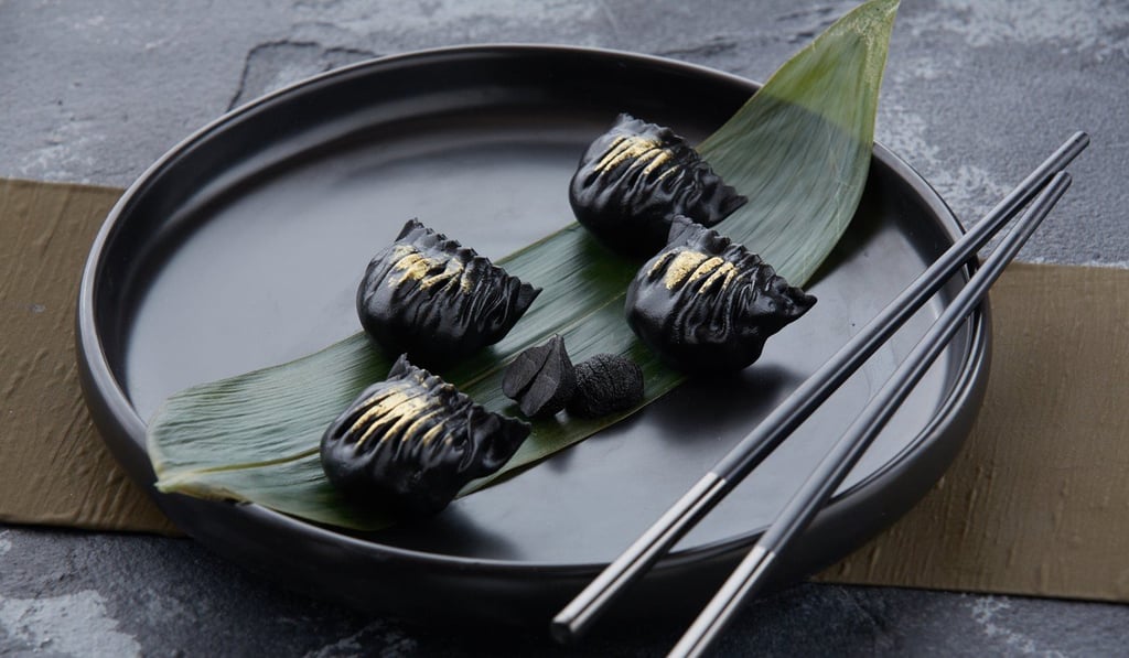 Steamed bamboo charcoal shrimp dumplings at HEXA restaurant.