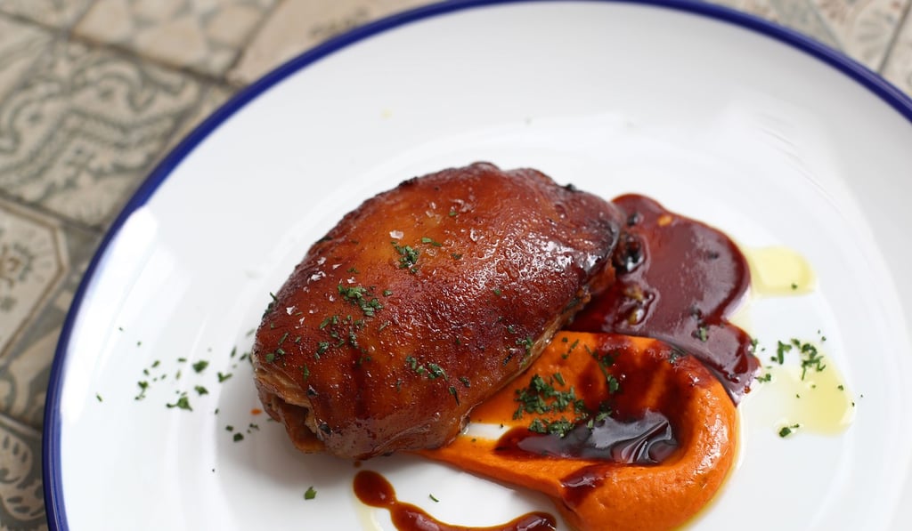 Suckling pig salsa de pimiento del piquillo. Photo: Nora Tam