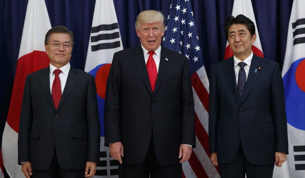 US President Donald Trump met with Japanese Prime Minister Shinzo Abe, right, and South Korean President Moon Jae-in at the Northeast Asia Security dinner at the US Consulate General in Hamburg in July. AP Photo/Evan Vucci, File) US President Donald Trump met with Japanese Prime Minister Shinzo Abe, right, and South Korean President Moon Jae-in at the Northeast Asia Security dinner at the US Consulate General in Hamburg in July. AP Photo/Evan Vucci, File)