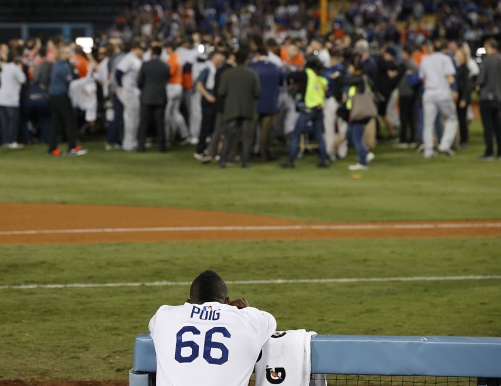 Puig watches as the Houston Astros celebrate their win. Photo: AP
