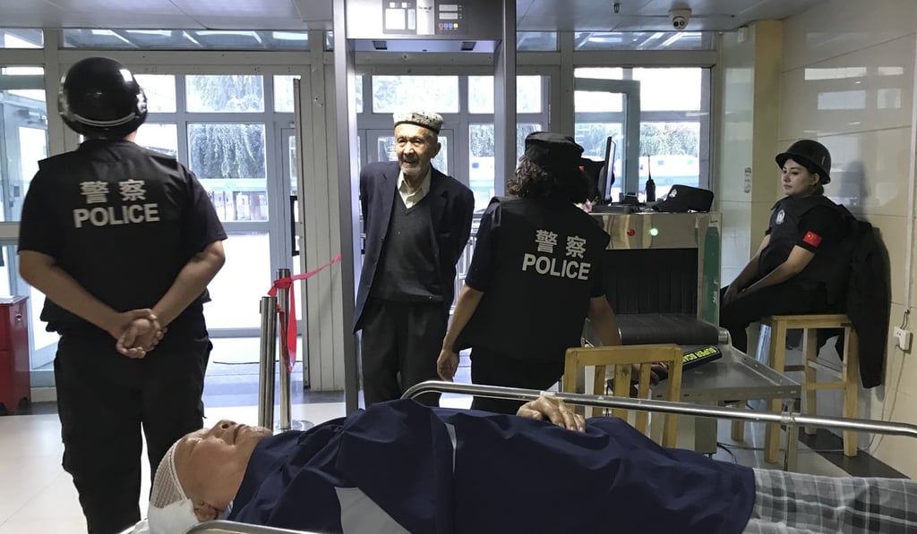 Heavy police security as a Uygur man walks through a metal detector into the hospital. Bernice’s father, Kai-Sun Chan, is lying on the stretcher in the foreground waiting for a CAT scan. Photo: Bernice Chan