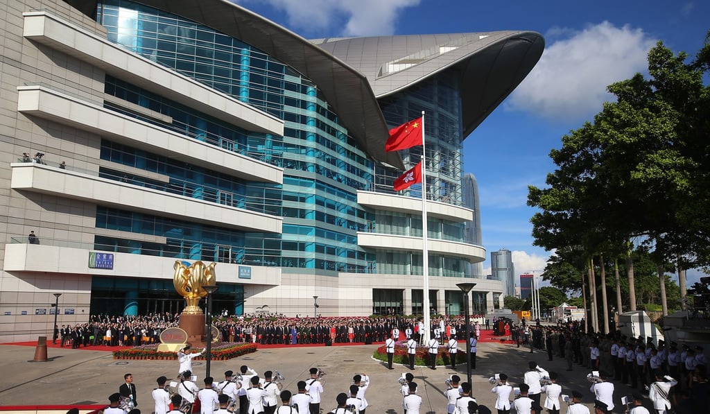 The local law would only regulate conduct in public settings, such as this flag-raising ceremony in Wan Chai. Photo: K. Y. Cheng