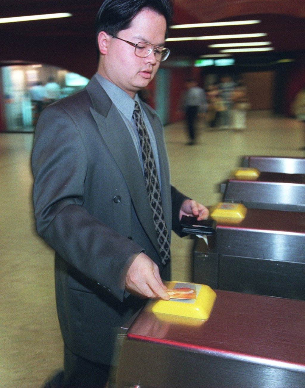 A man uses an Octopus card at Central MTR station in 1997, not long after the scheme was introduced in Hong Kong. Photo: Antony Dickson