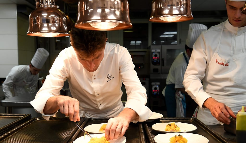 French chef Jean Sulpice prepares a dish in the kitchen of his restaurant ‘L'Auberge du Pere Bise’ in Talloires in the French Alps. Photo: AFP French chef Jean Sulpice prepares a dish in the kitchen of his restaurant ‘L'Auberge du Pere Bise’ in Talloires in the French Alps. Photo: AFP