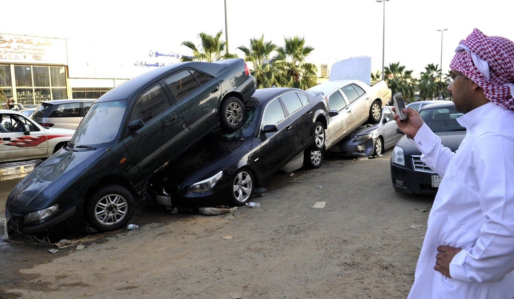 Vehicles are piled up in Jeddah following the 2011 floods. Photo: AFP