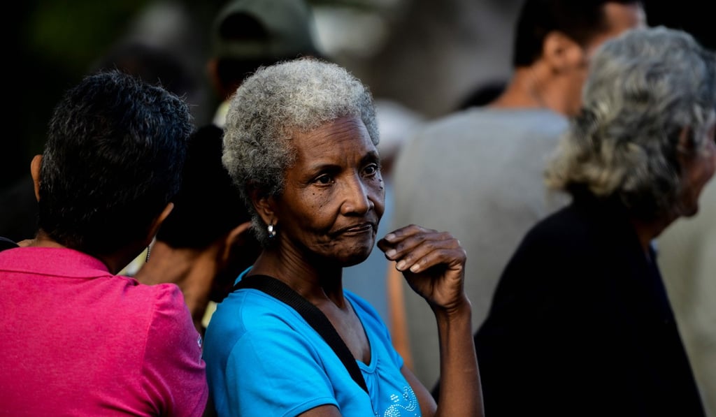 People queue at a bus stop in Catia, a neighbourhood of Caracas, Venezuela, as the crisis in the country deepened. Photo: Agence France-Presse People queue at a bus stop in Catia, a neighbourhood of Caracas, Venezuela, as the crisis in the country deepened. Photo: Agence France-Presse
