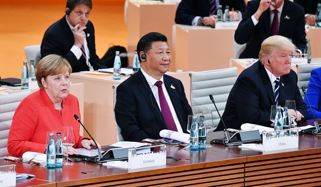 German Chancellor Angela Merkel, Chinese President Xi Jinping and US President Donald Trump at a Group of 20 summit meeting in Hamburg, Germany in July. The Trump administration’s decertification of the Iran nuclear deal has put both European and Asian leaders on edge, waiting to see whether the US Congress reinstitutes sanctions. Photo: Kyodo