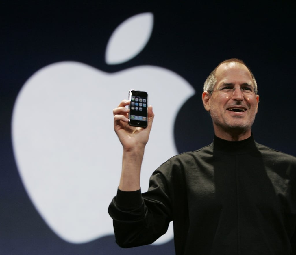 Apple CEO Steve Jobs holds up the new iPhone during his keynote address at MacWorld Conference & Expo in San Francisco in 2007. Photo: AP