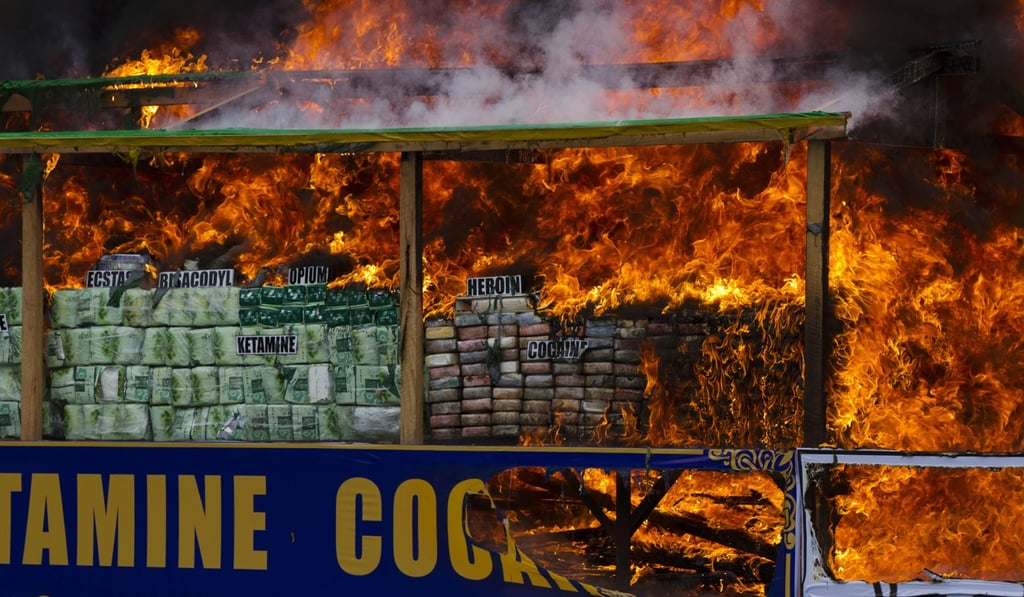 Smoke and flames billow from a destruction ceremony for seized narcotics on the outskirts of Yangon, Myanmar, in June. Authorities destroyed the drugs to mark the International Day against Drug Abuse and Illicit Trafficking. Photo: AP