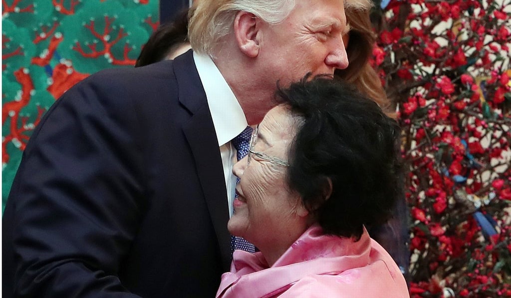 US President Donald Trump embraces Lee Yong-soo, a former 'comfort woman' who was forced into sexual slavery by Japan's military. Photo: EPA US President Donald Trump embraces Lee Yong-soo, a former 'comfort woman' who was forced into sexual slavery by Japan's military. Photo: EPA
