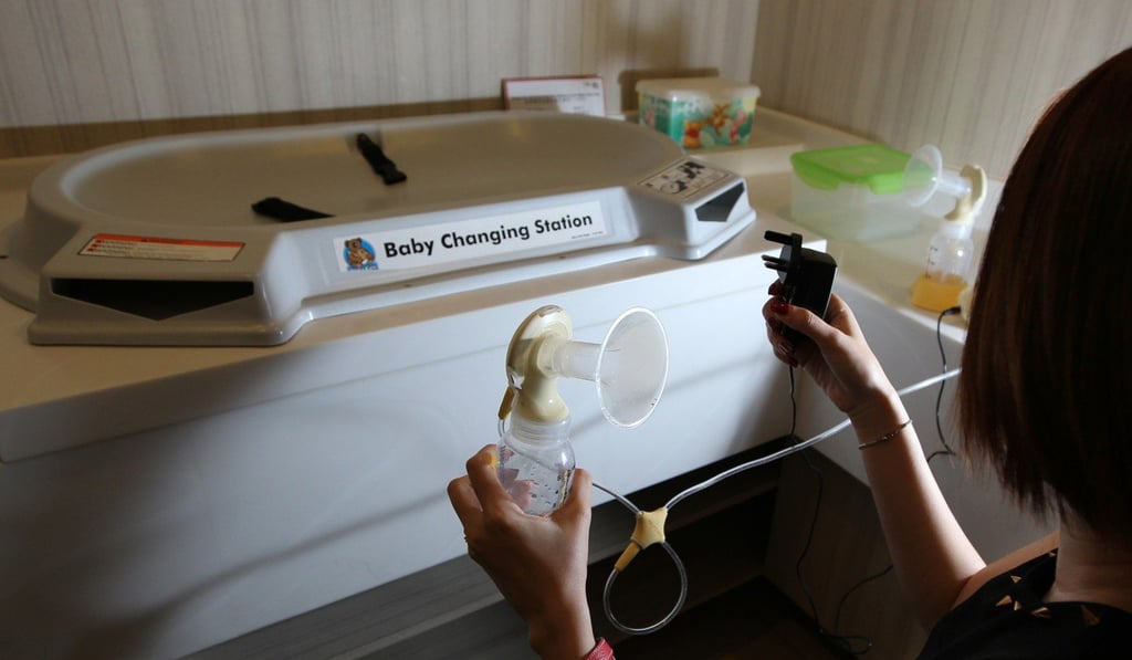 A breastfeeding mother searches for a power socket for her milk-pumping device in a nursing room at the IFC mall in Central. Photo: Nora Tam