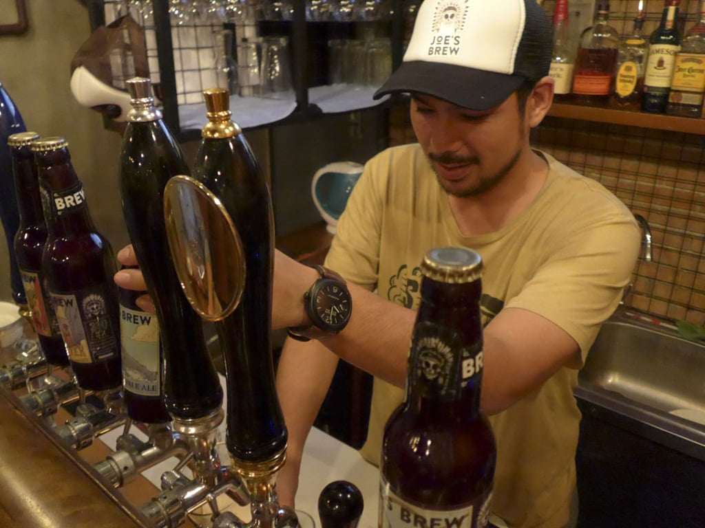 Joe’s Brew owner, Marco Viray, pours a beer at his bar in Manila. Photo: Cheryl Tiu