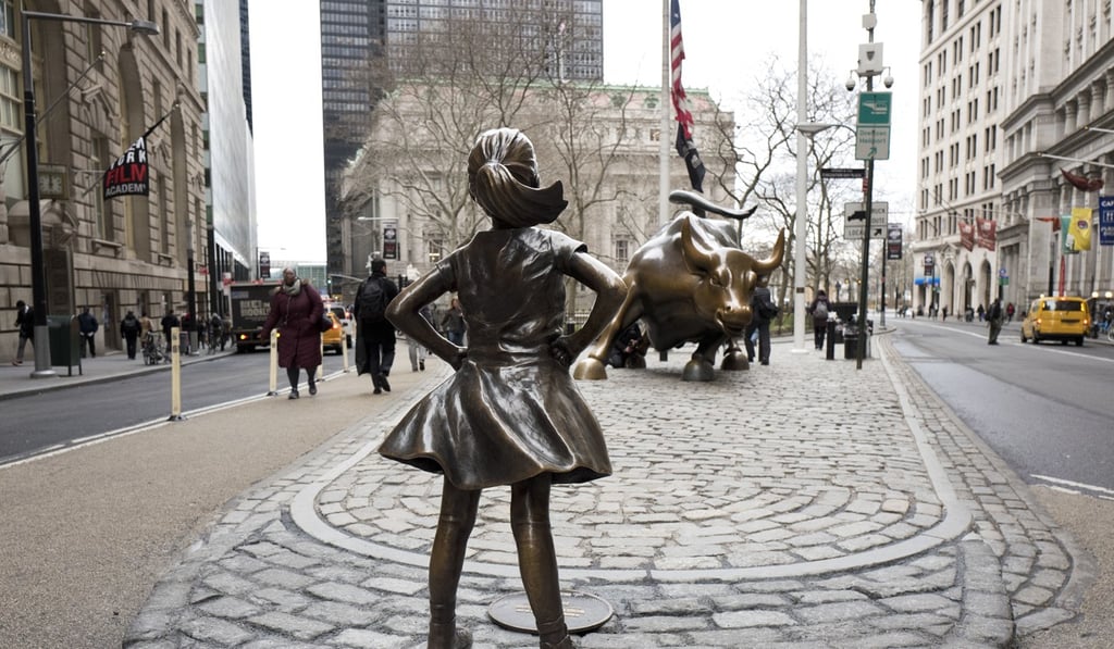 The “Fearless Girl” statue faces Wall Street's “Charging Bull”. When New York quits working in the evening, Hong Kong starts. Photo: AP