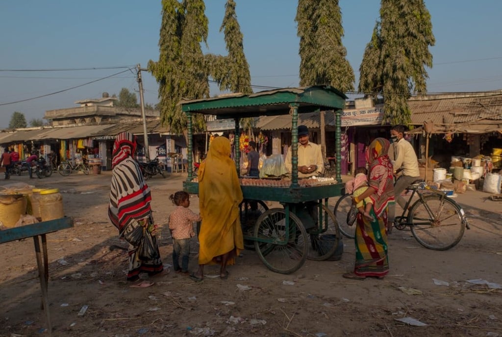 Veiled women shop at a market near Sabaila village, in Nepal.
