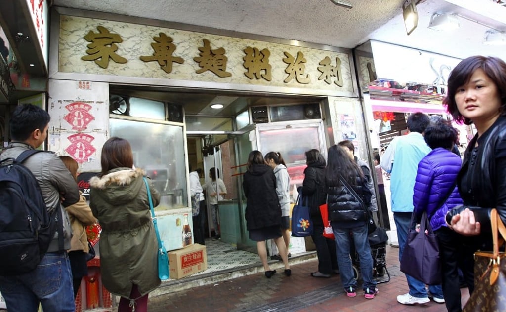 A queue outside Lei Yuen, a 40-year-old noodle and congee shop in Causeway Bay, before it closed in 2013. Picture: SCMP